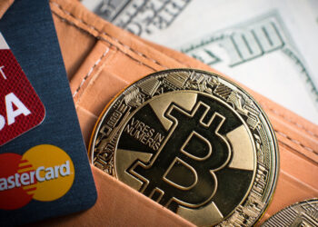 Debit cards, Bitcoin and dollar bills