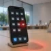 iPhone displaying suspicious wallet-style app icons with one glowing red inside an Apple Store, symbolizing concerns over fake crypto apps on the App Store under new leadership