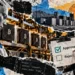 Editorial collage of an AI robot, Bitcoin mining rigs, and a human operator reviewing approval and rejection controls for equipment commands.