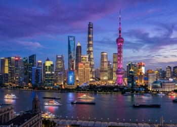 Editorial illustration of the Shanghai Pudong metropolitan financial skyline across the Huangpu River